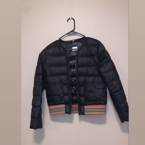 Like new Burberry puffer jacket no tears or stains nice for a everyday wear